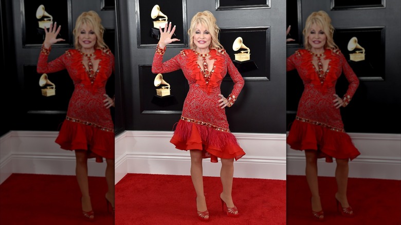 Dolly Parton wears a red dress and heels to the 2019 Grammy Awards