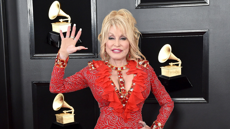 Dolly Parton wears a red dress to the 2019 Grammy Awards