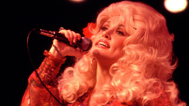 Dolly Parton performing on stage in the United Kingdom in 1976