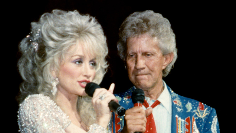 Dolly Parton and Porter Wagoner on stage together in the 1990s.