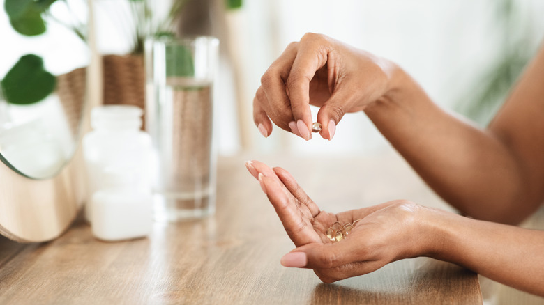 woman taking supplement