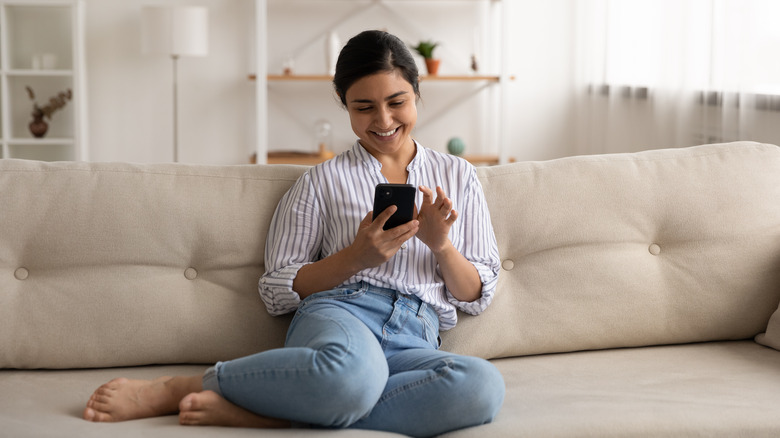 Woman on phone on couch