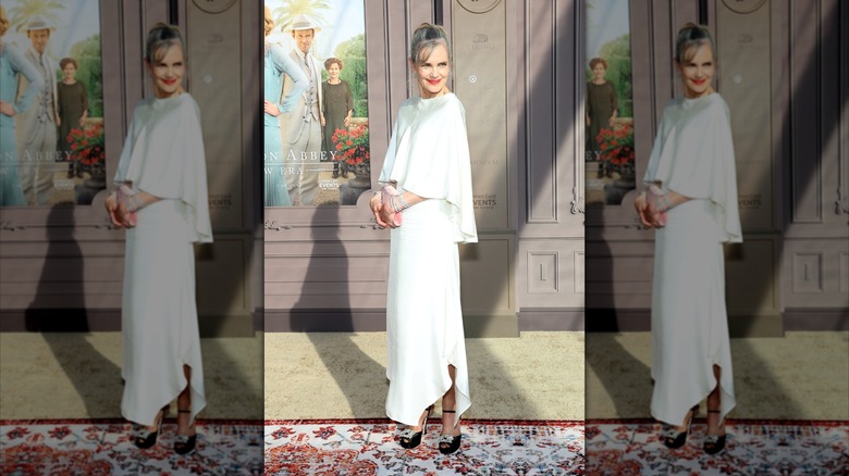 Elizabeth McGovern pictured wearing a white cape-style dress to the ﻿"Downton Abbey: A New Era" New York premiere