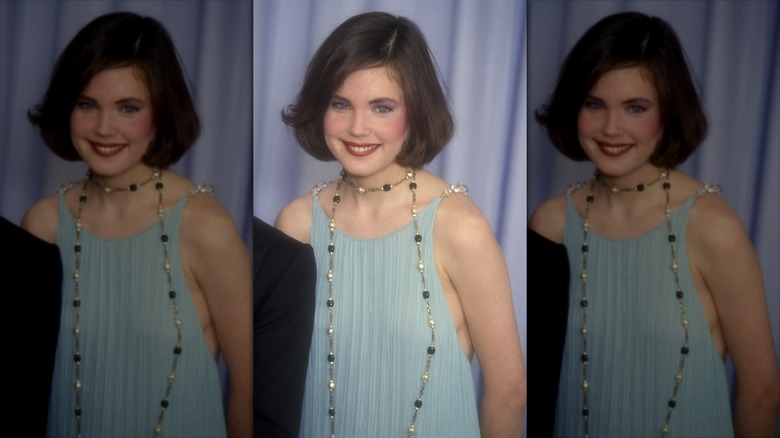 Elizabeth McGovern smiles wearing her hair in a soft brown bob