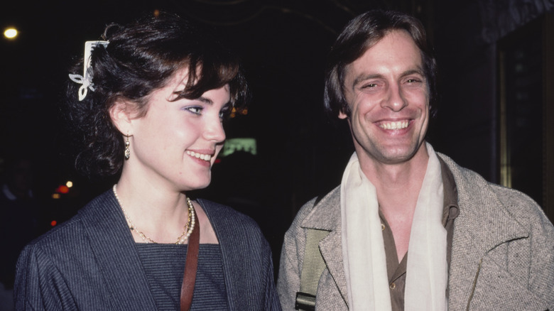 Elizabeth McGovern looks at Keith Carradine wearing her hair clipped and with bangs