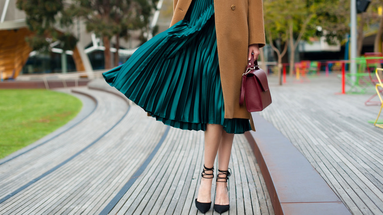 Woman in green pleated dress 