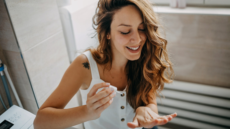 Woman giving herself a manicure