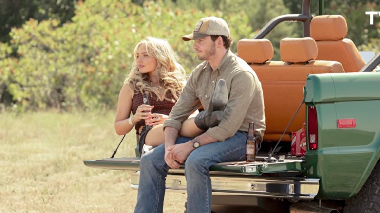 Oreana Jackson sits with her legs on and Carter Dutton in a scene from 