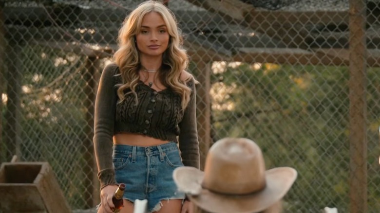 Oreana Jackson wearing a cropped cable knit cardigan in a scene from "Dutton Ranch."