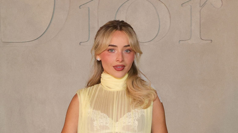 Sabrina Carpenter wearing a sheer yellow dress