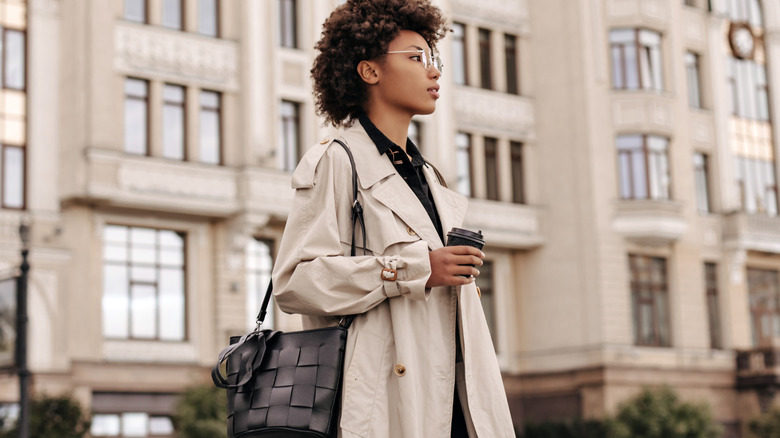 Young woman wearing trenchcoat