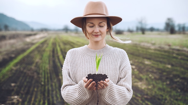 Woman holding a plant