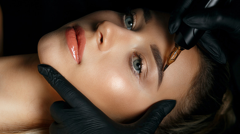 Woman getting bushy brows