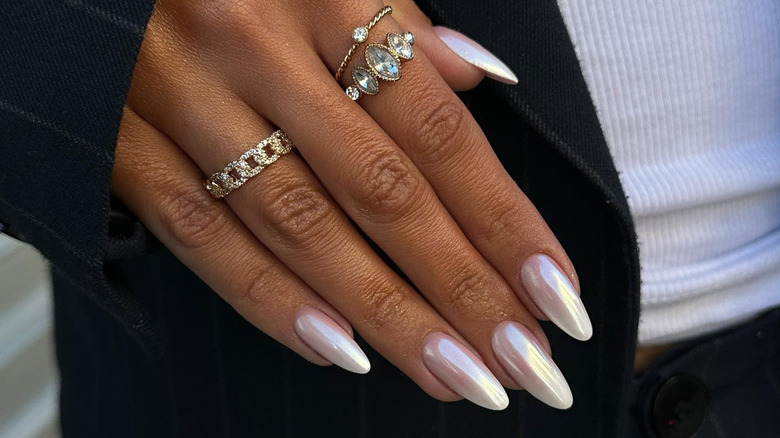 hand with white chrome manicure