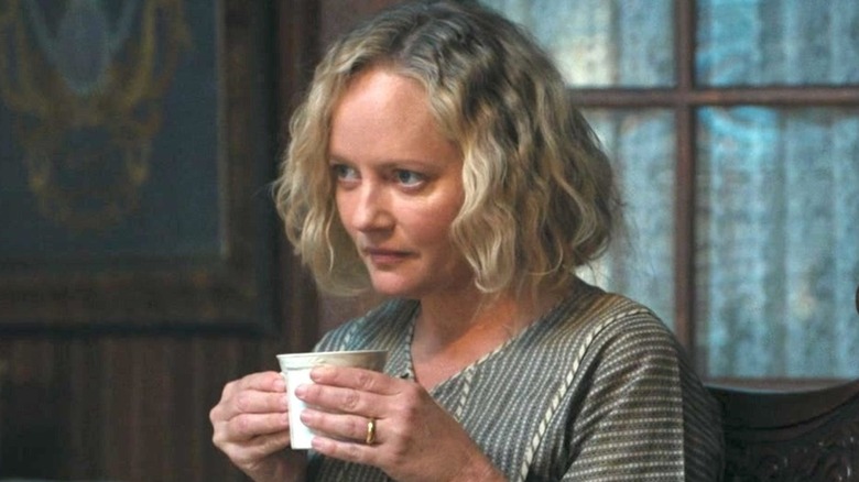 Marley Shelton with wavy blond hair as Emma Dutton in 