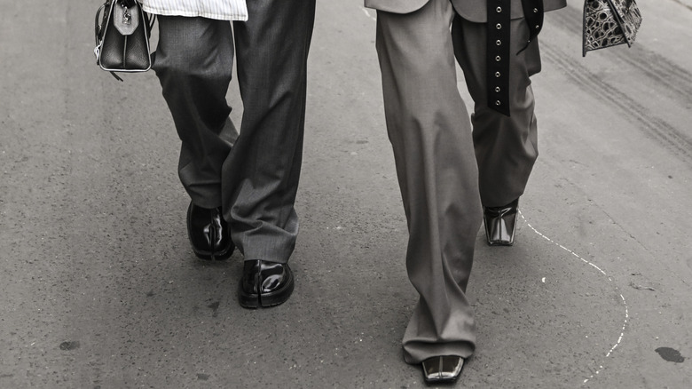 Two people wearing baggy pants