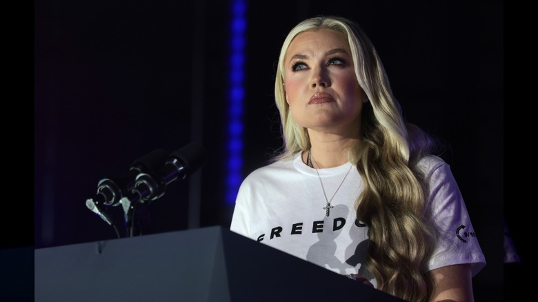 Erika Kirk stands at a podium addressing a crowd