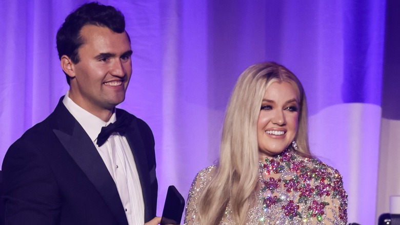 Erika Kirk smiling alongside her husband Charlie in a sequined gown