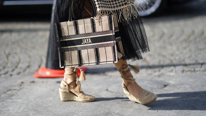 Woman wearing beige espadrilles