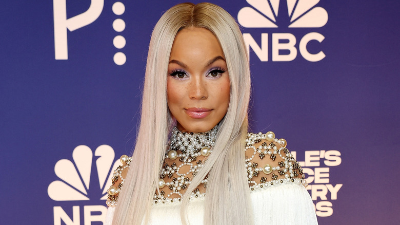 Tanner Adell in a fringed and beaded dress at the 2024 People's Choice Country Awards.