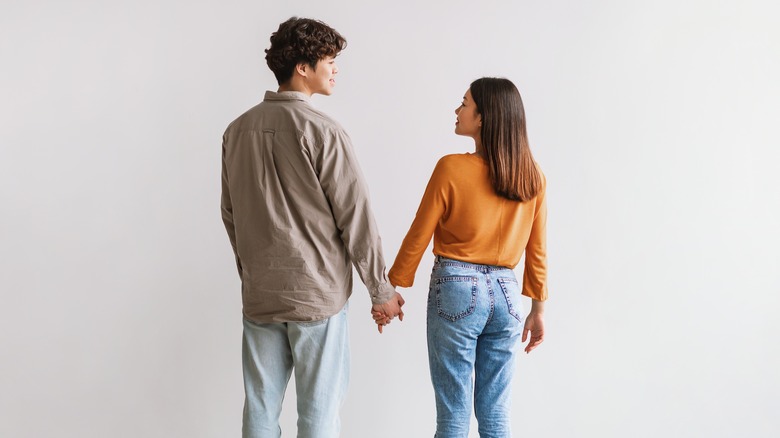 Couple holding hands 