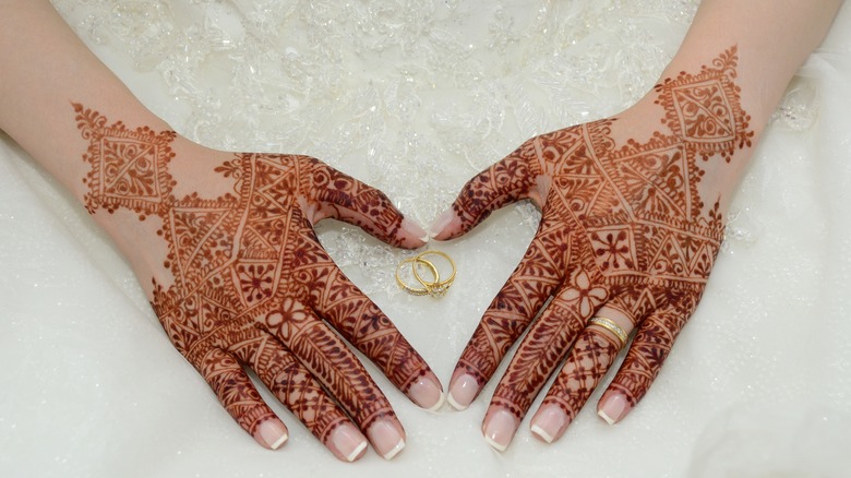 henna tattooed hands