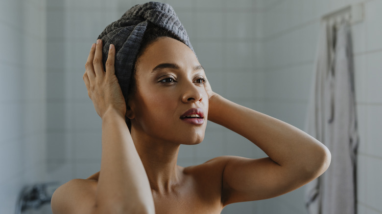 woman wearing wet hair in towel