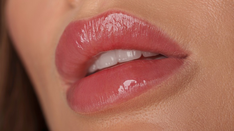 A woman with a lip blushing tattoo