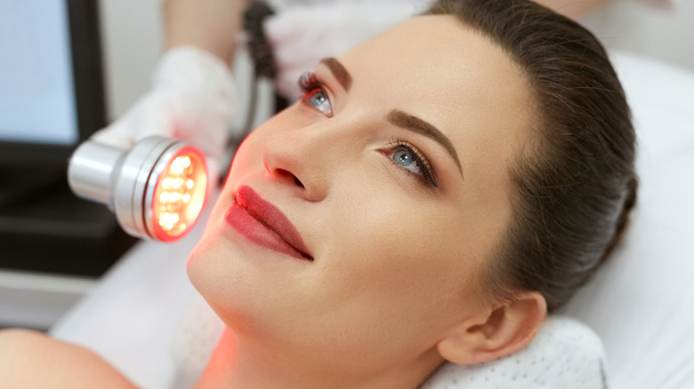 A woman getting LED light therapy