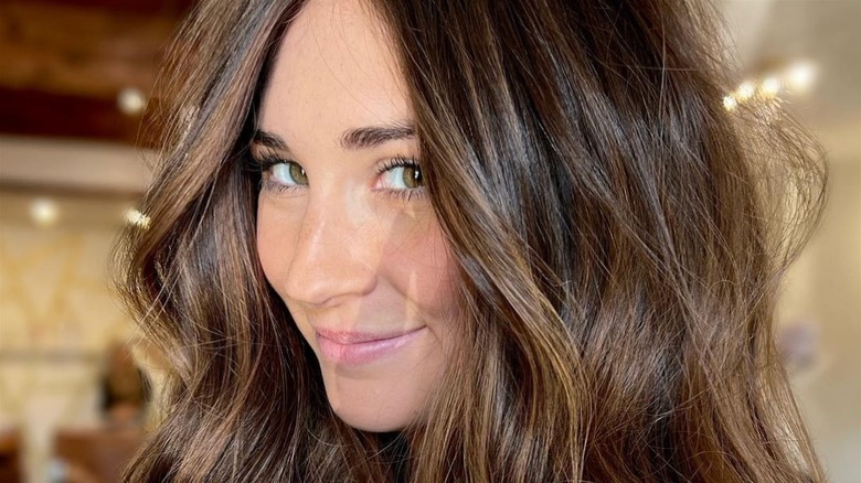 brunette woman smiling 