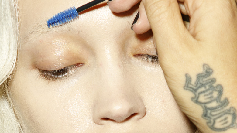 Woman with bleached blonde eyebrows