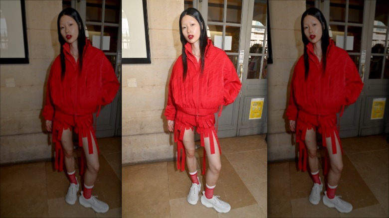 A woman wearing a red jacket