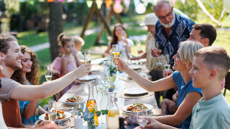 A large family gathering outside