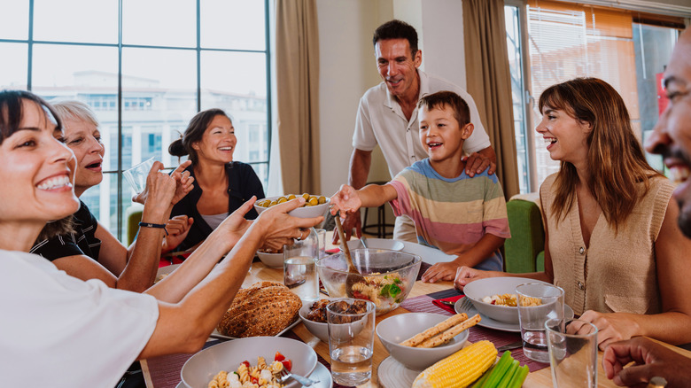 Happy family sitting around the table