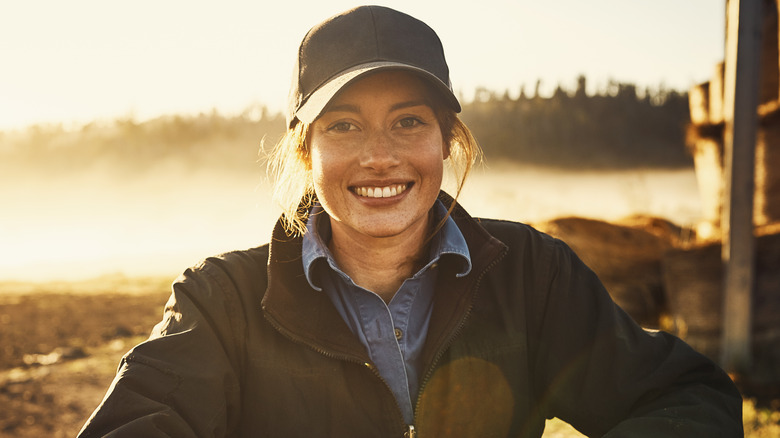 Woman smiling on a farm