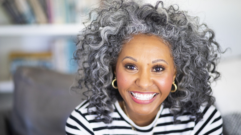 Woman with curly hair smiling