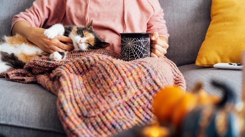 Woman watching movies during Halloween