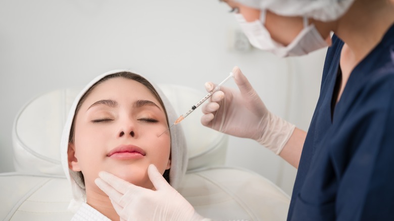 Woman getting filler injection