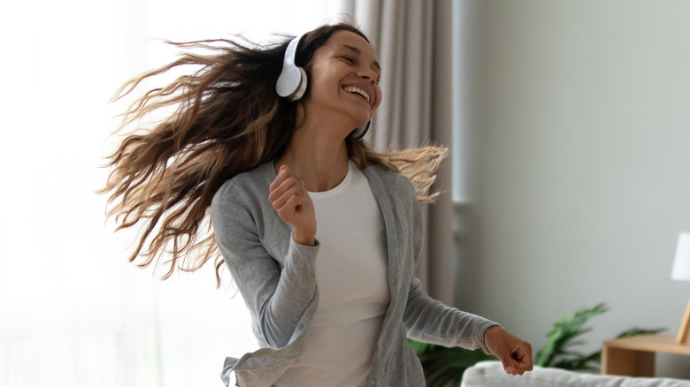 dancing woman wearing headphones