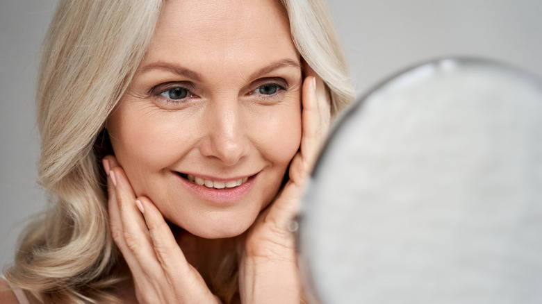 Woman looking in mirror 