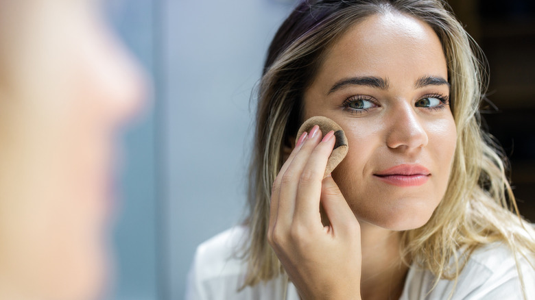 Woman applying powder