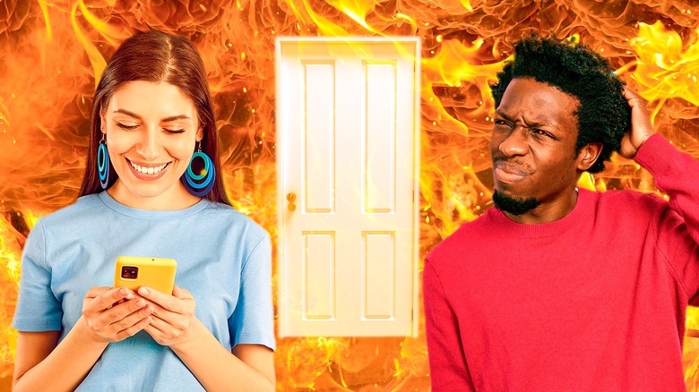 composite unhappy couple fire background