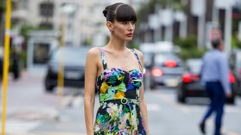 woman in floral sleeveless dress 