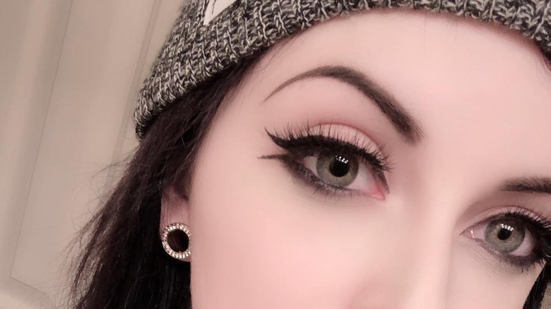 woman with fishtail eyeliner