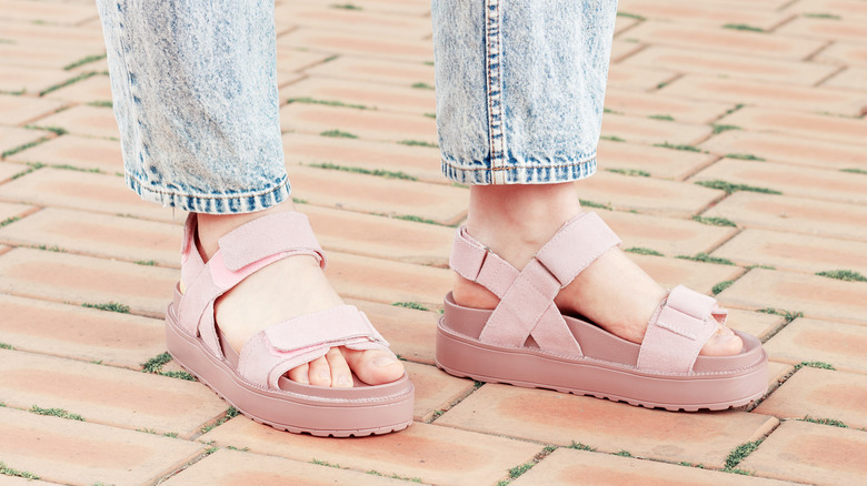 person in pink flatform sandals