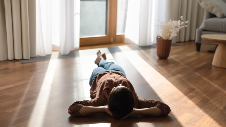 Relaxed woman lying on floor