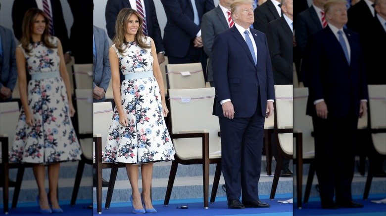 Melania Trump in a white floral dress with Donald Trump