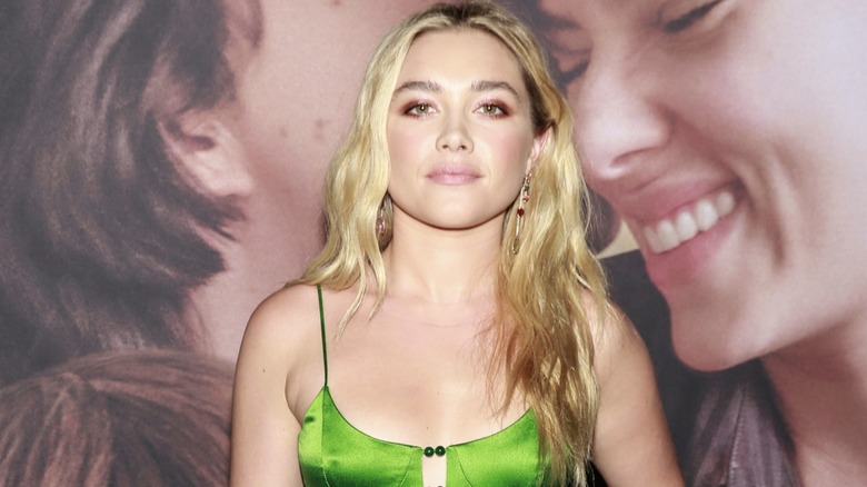 Florence Pugh wearing loose mermaid waves and a pink dress