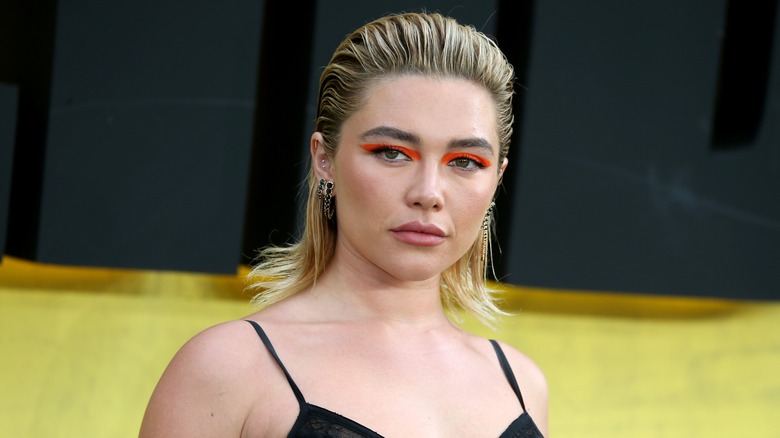 Florence Pugh wearing a slicked back wet look and graphic liner