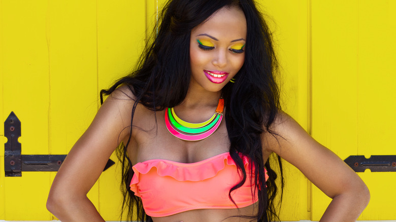 Woman wearing neon orange bikini